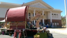 The Peripatetic Players set up their stage, FluxWagon, in front of the Port Costa School during the 2015 Bay Area tour of AESOP AMUCK.